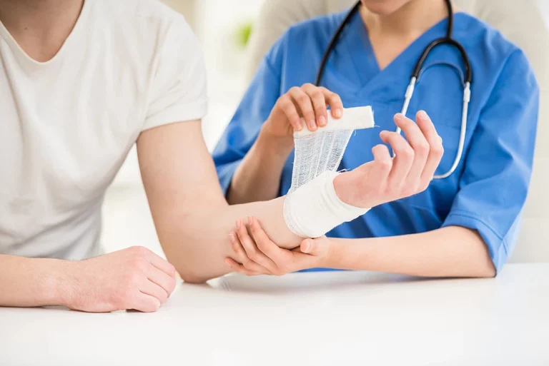 A nurse bandages a patient's arm at an Ambetter approved urgent care in Houston.