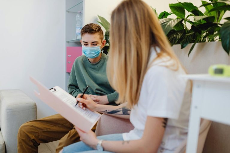 Provider documenting patient intake information for quick, walk-in urgent care services.