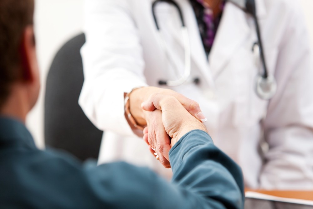 A doctor and a patient shake hands, a key interaction during an appointment at an Ambetter Health Urgent Care Clinic.