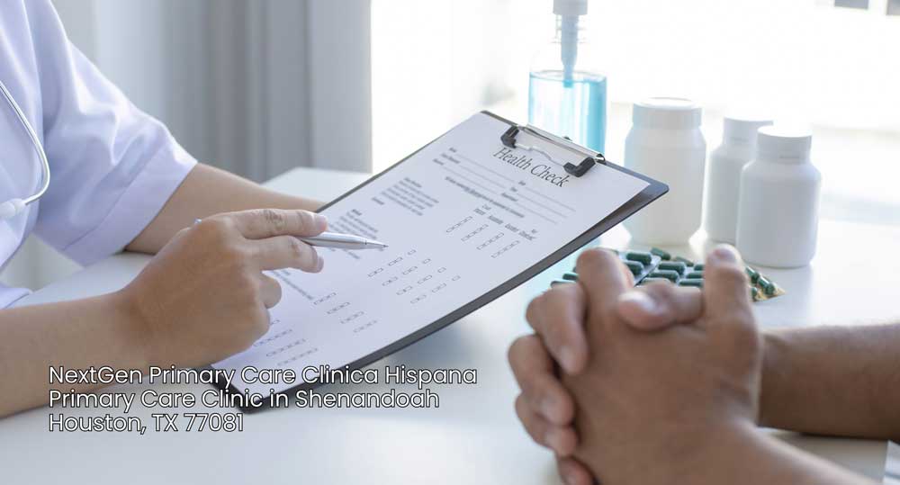 Doctor reviewing a health check chart during a patient consultation at a primary care clinic Houston office.