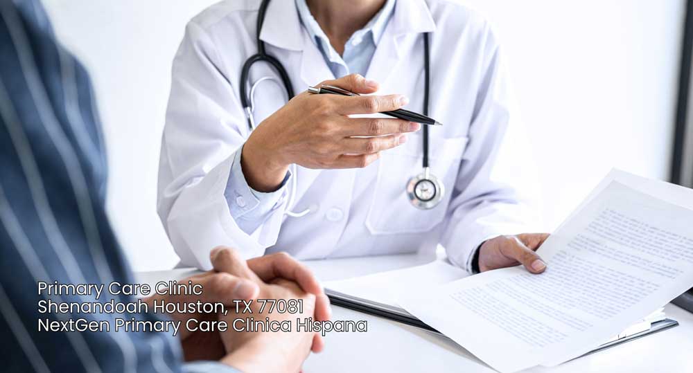 Doctor at a primary care clinic Houston reviewing medical paperwork with a patient during a routine consultation.